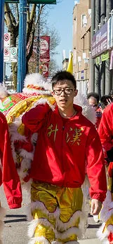 Darren Jhong carrying a lion head